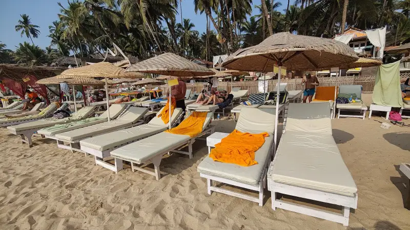 Sun loungers and umbrellas on Palolem beach in South Goa