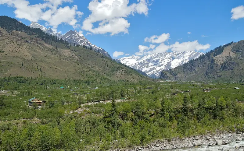 Green Beas river valley near Manali with snow-capped Himalayan peaks