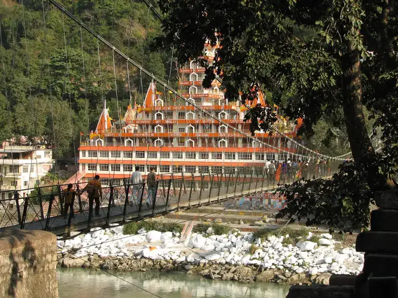 Temple buildings and suspension bridge over the Ganga at Rishikesh