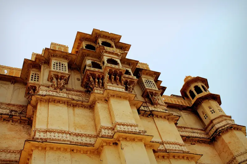 Ornate golden facade of the City Palace in Udaipur